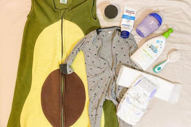baby supplies ready after bath sleep sack diaper