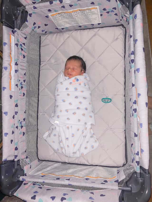 swaddled-newborn-baby-sleeping-pack-n-play swaddled newborn baby sleeping pack n play
