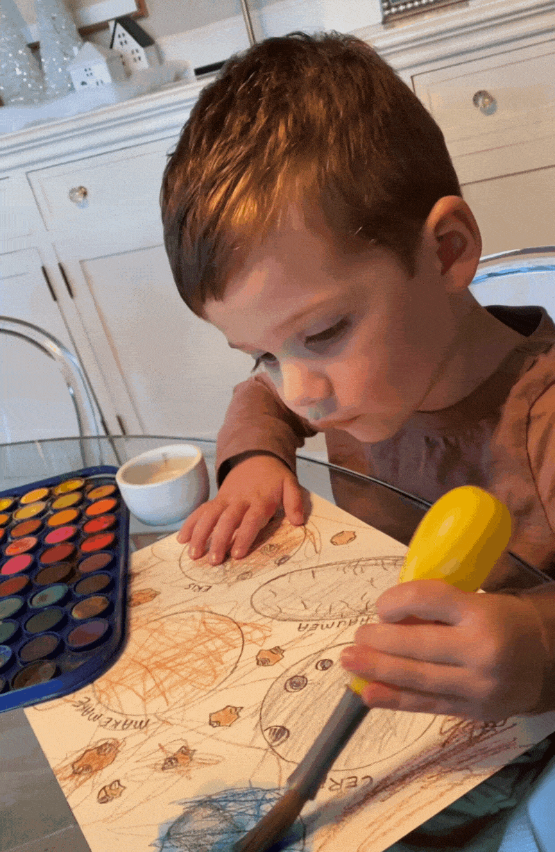 toddler using paint brush