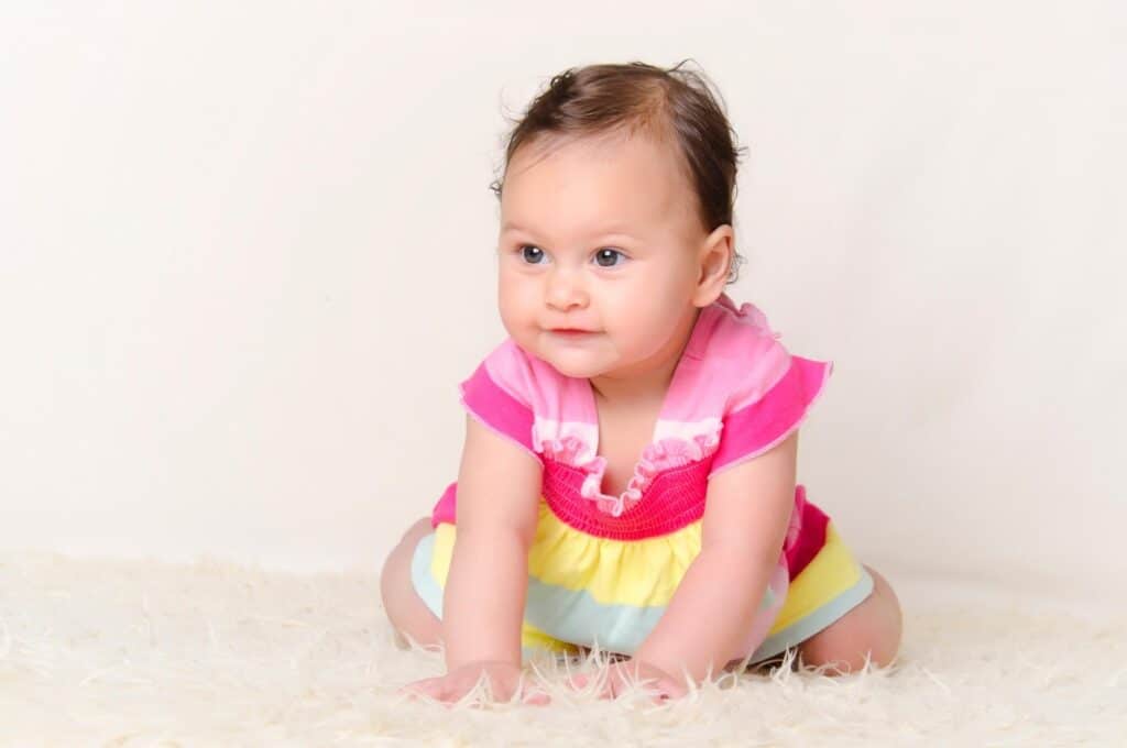 baby girl wearing colorful dress