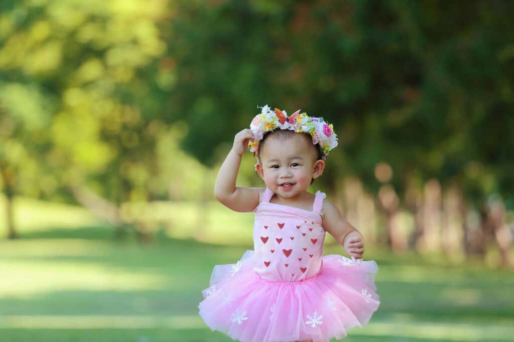 asian baby girl pink tutu trees