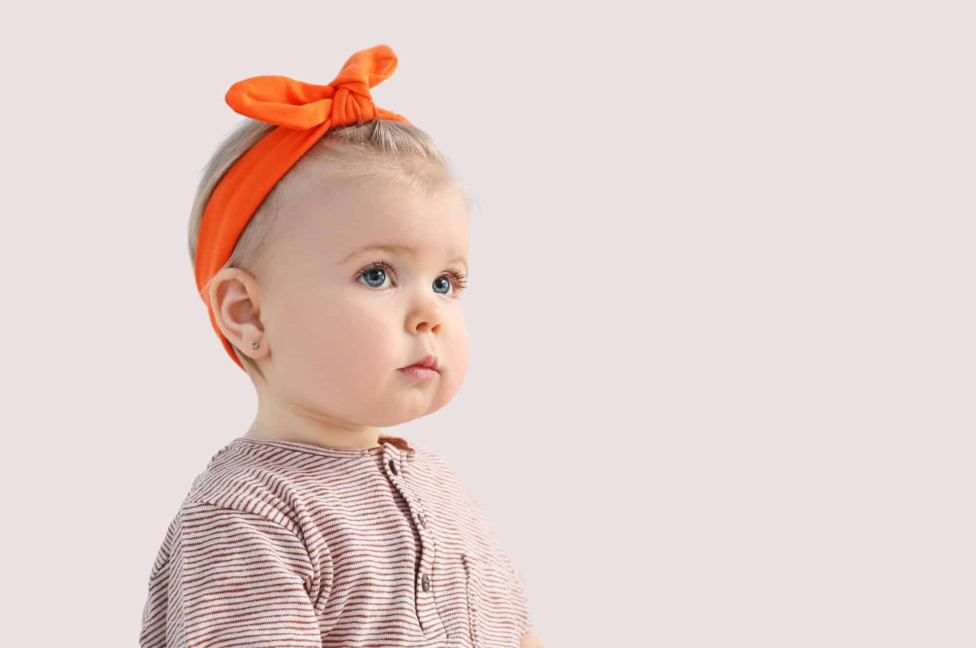baby girl blue eyes orange headband