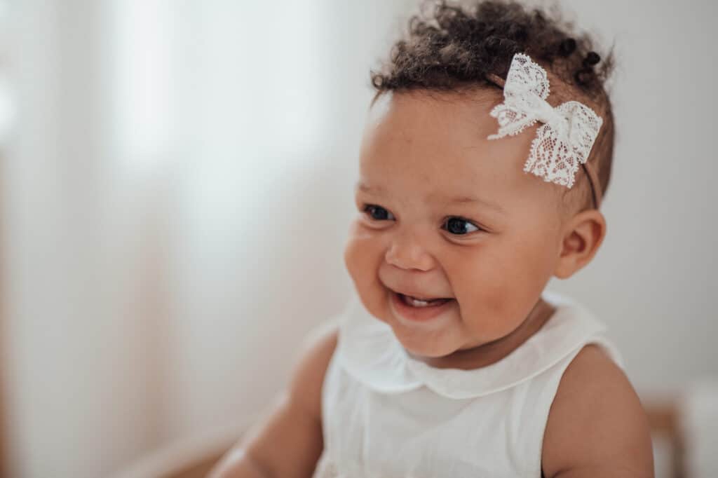 smiling baby girl headband bow