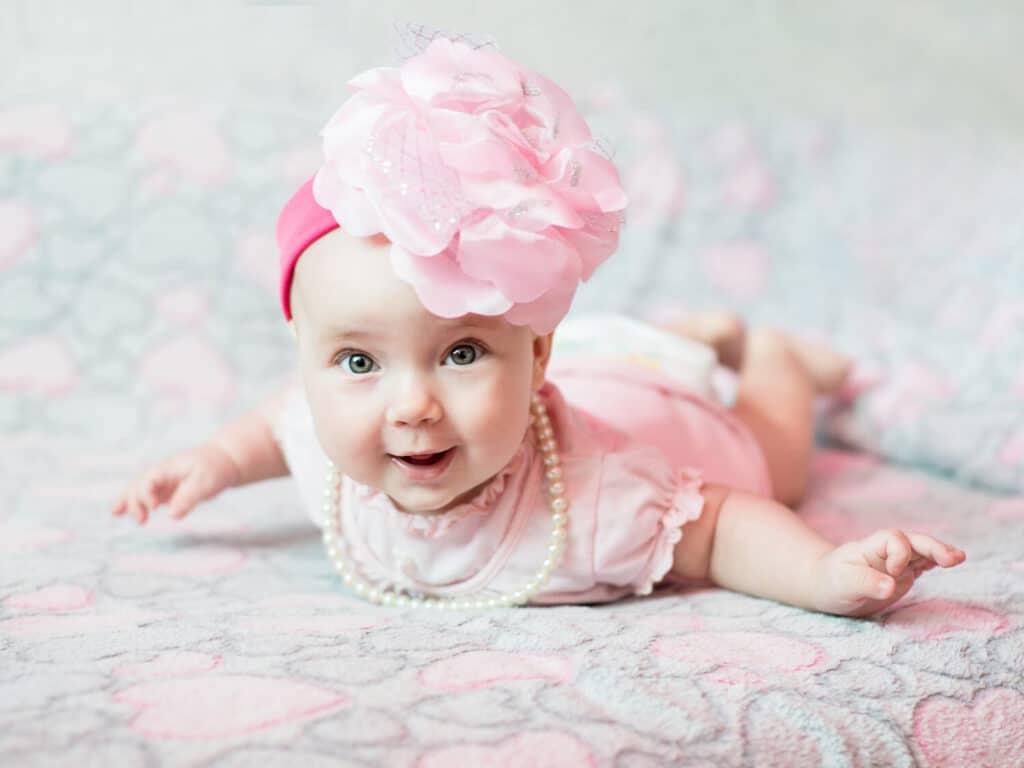 baby with giant flower headband