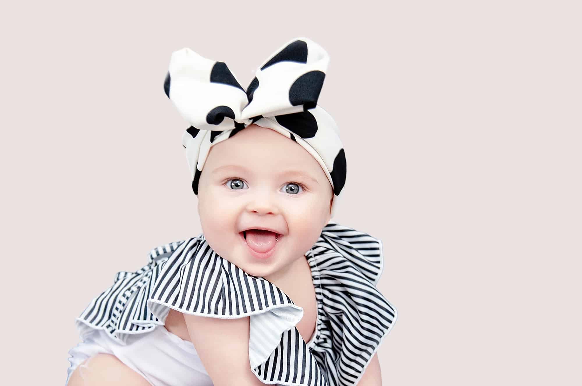 baby girl wearing large black and white bow
