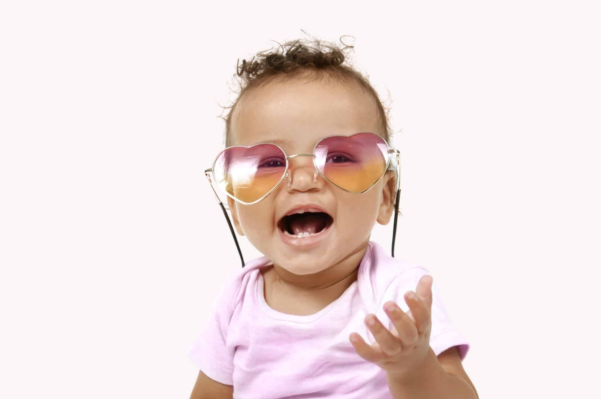 baby girl laughing heart shaped glasses