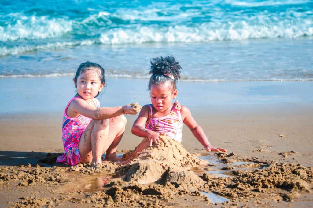 little girls playing at beach
