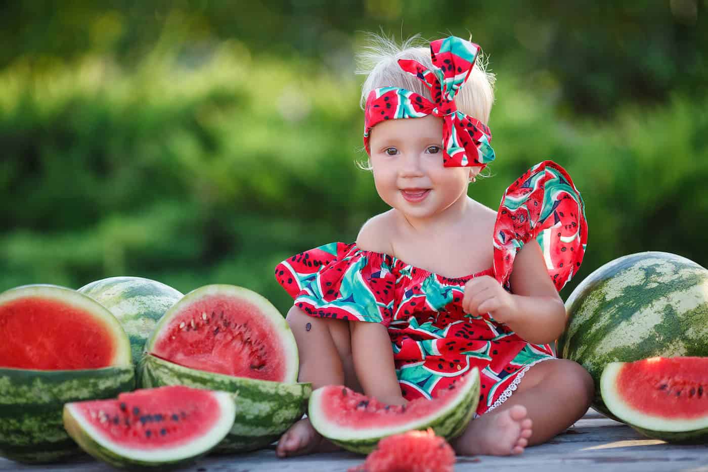 baby girl with watermelons summer