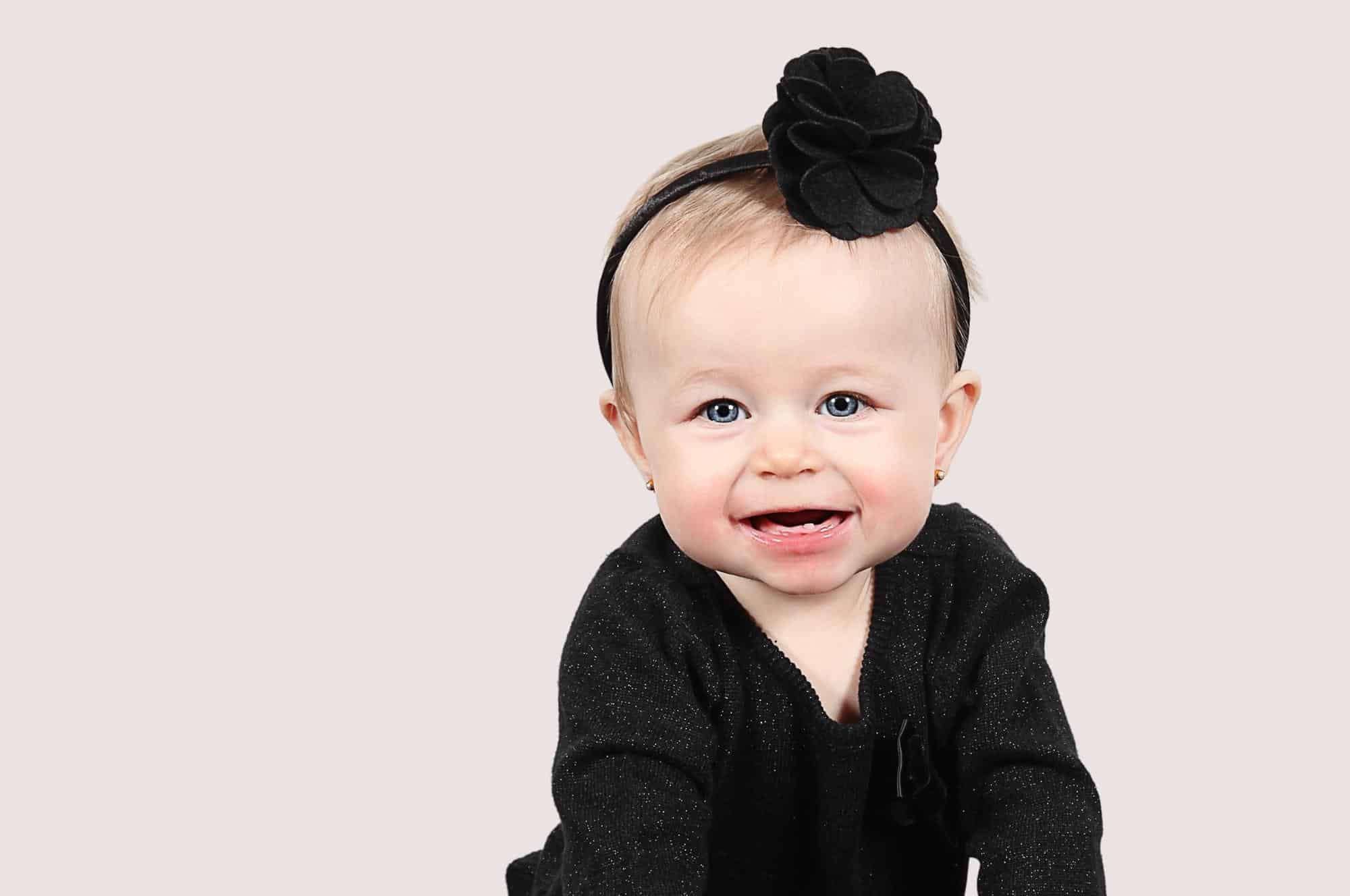 baby girl smiling black headband and outfit