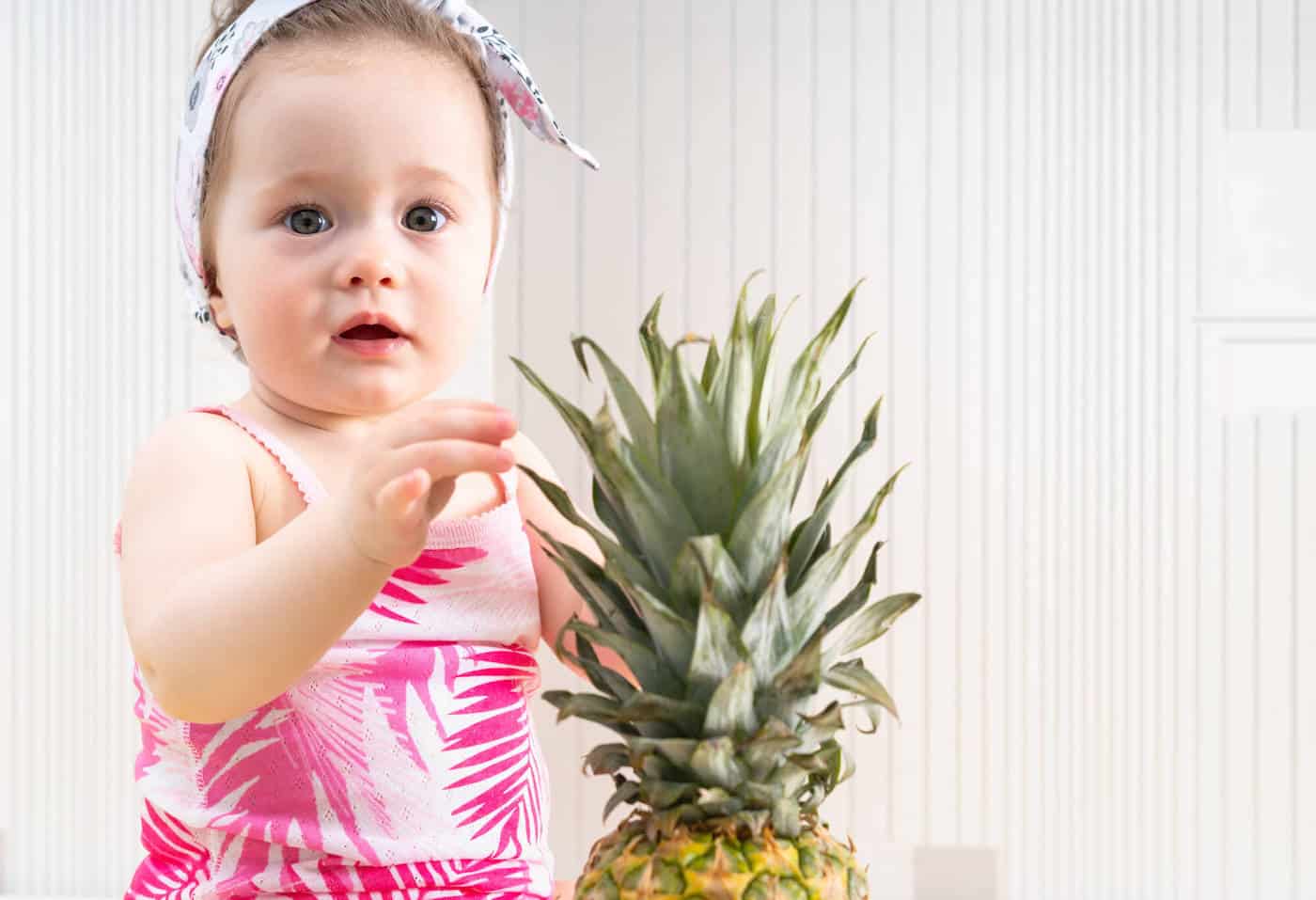 baby girl with pineapple