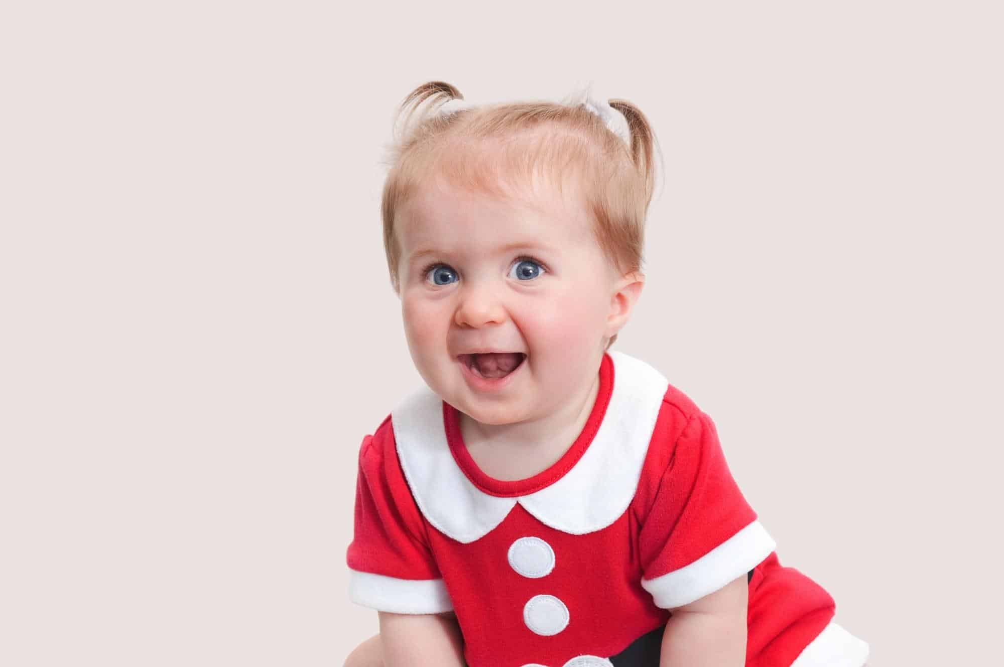baby girl with red dress + pig tails
