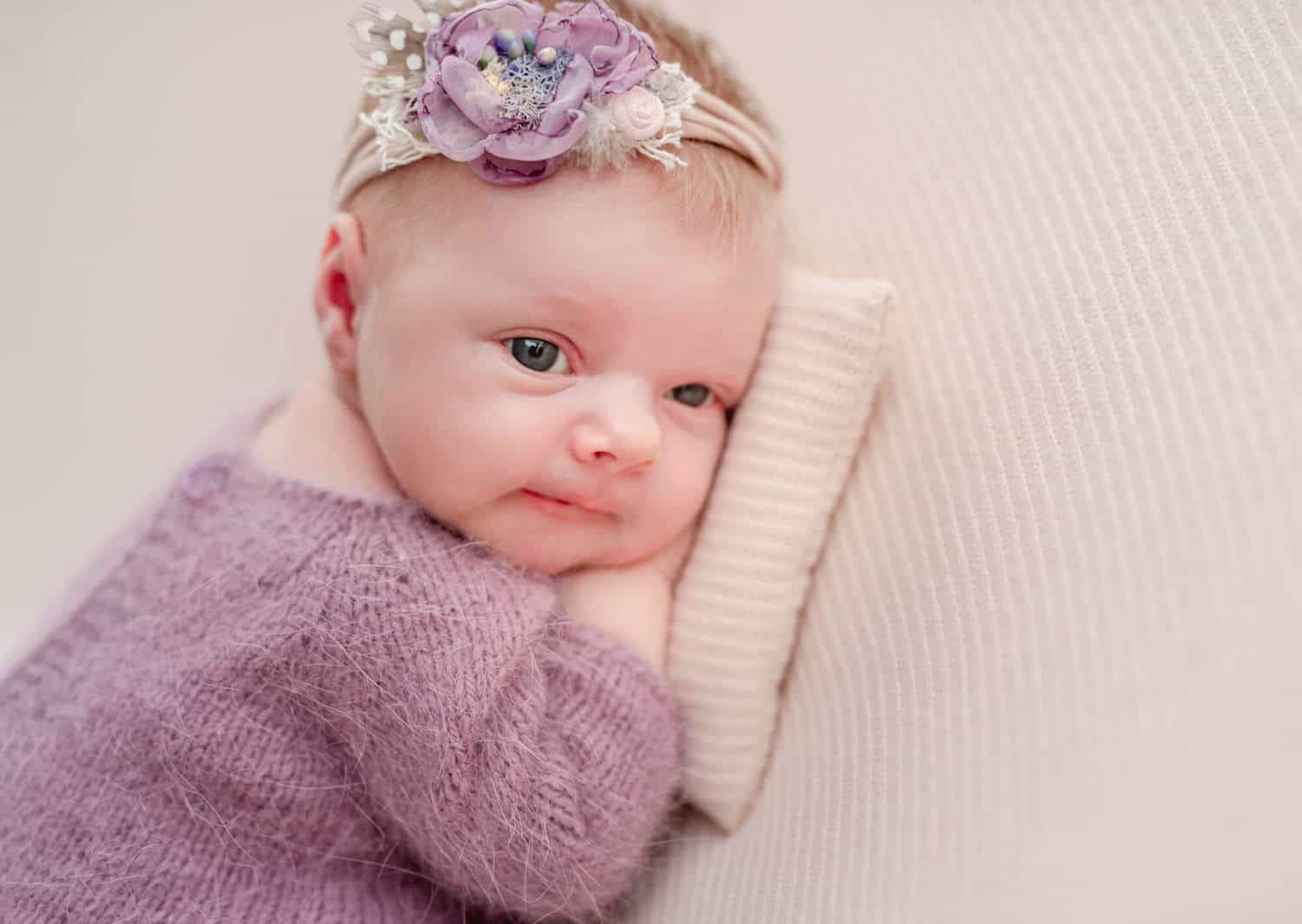 beautiful newborn baby girl with eyes open