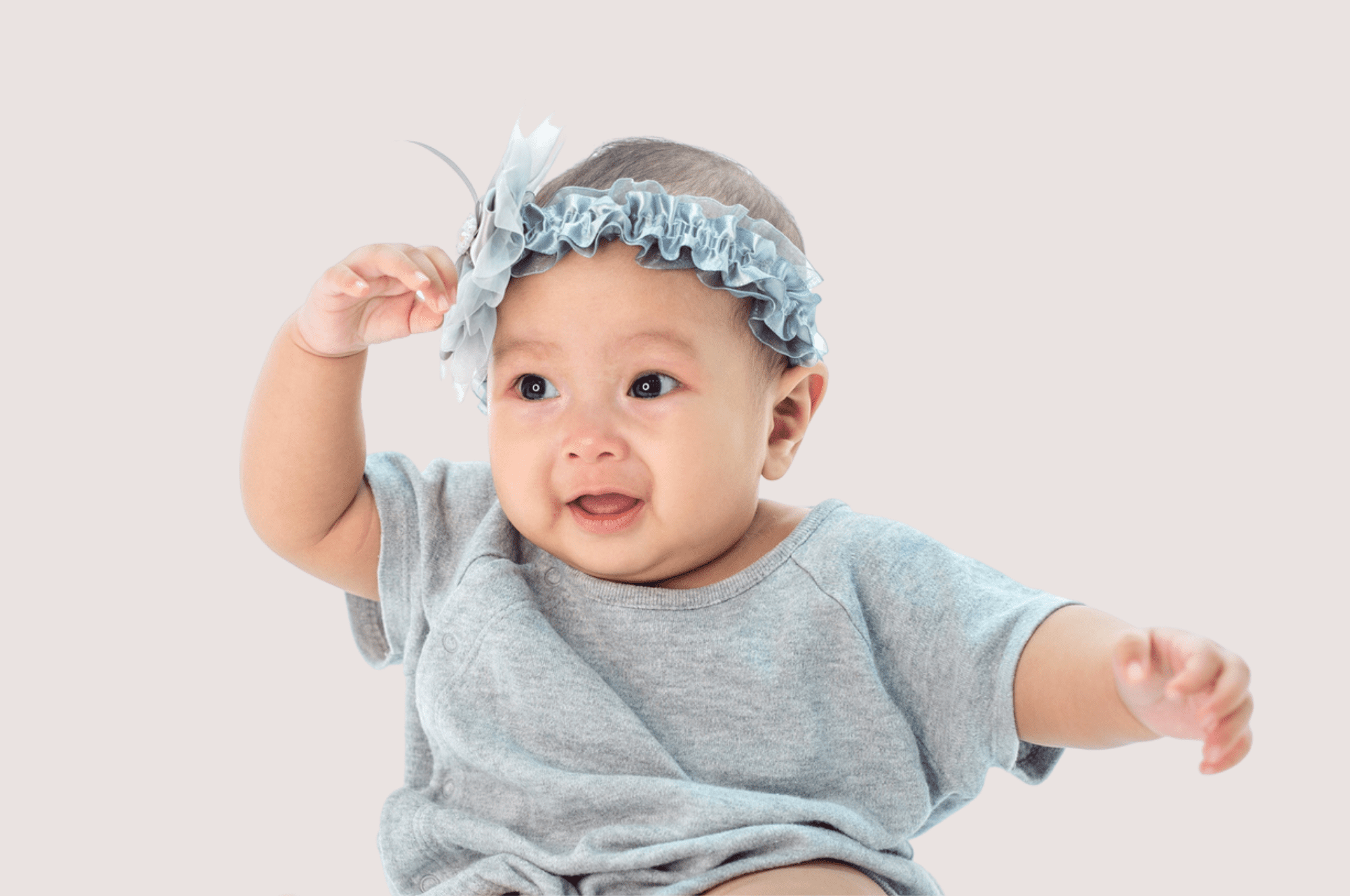 baby girl in gray outfit