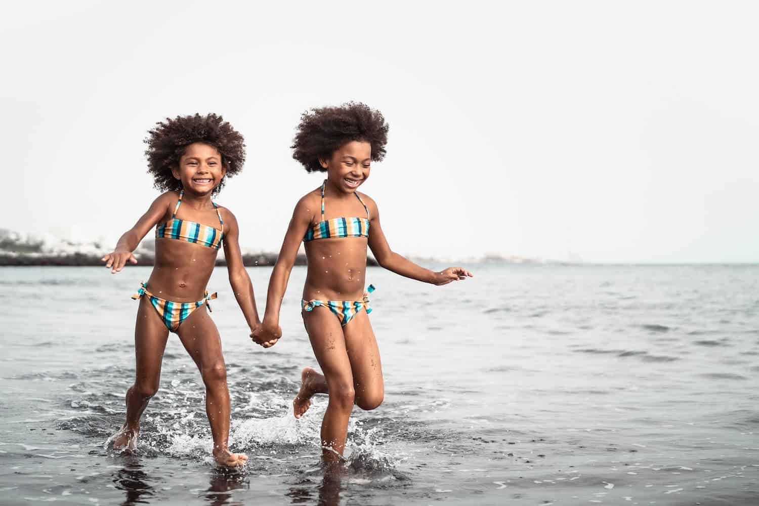 twin girls on beach