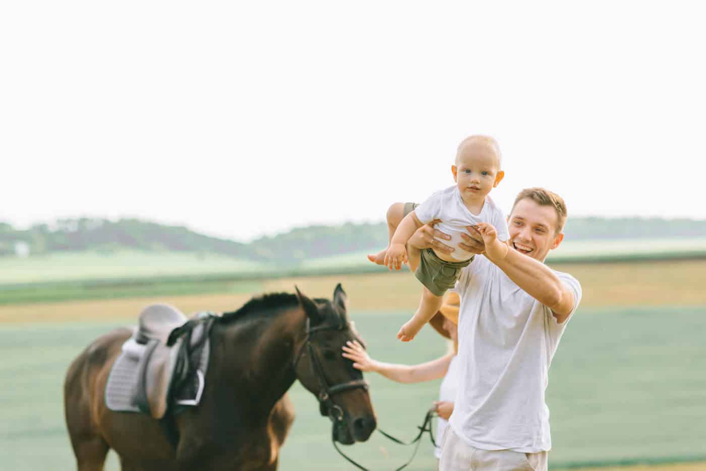 irish dad baby and horse in ireland