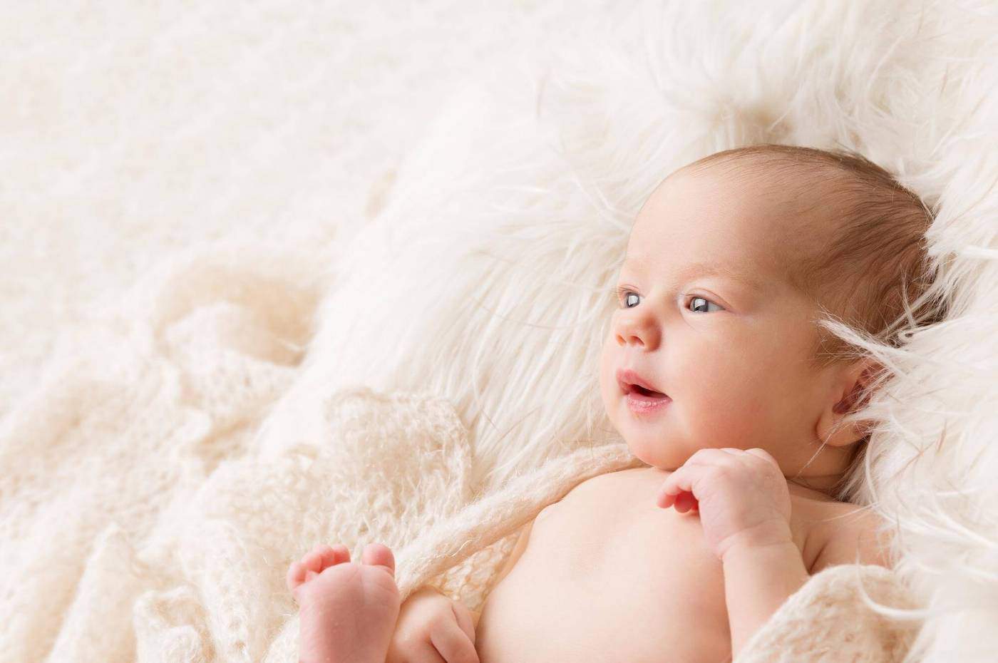 scottish newborn baby in white blankets