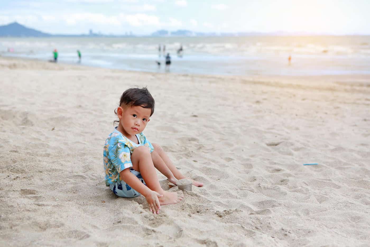 little boy on exotic beach