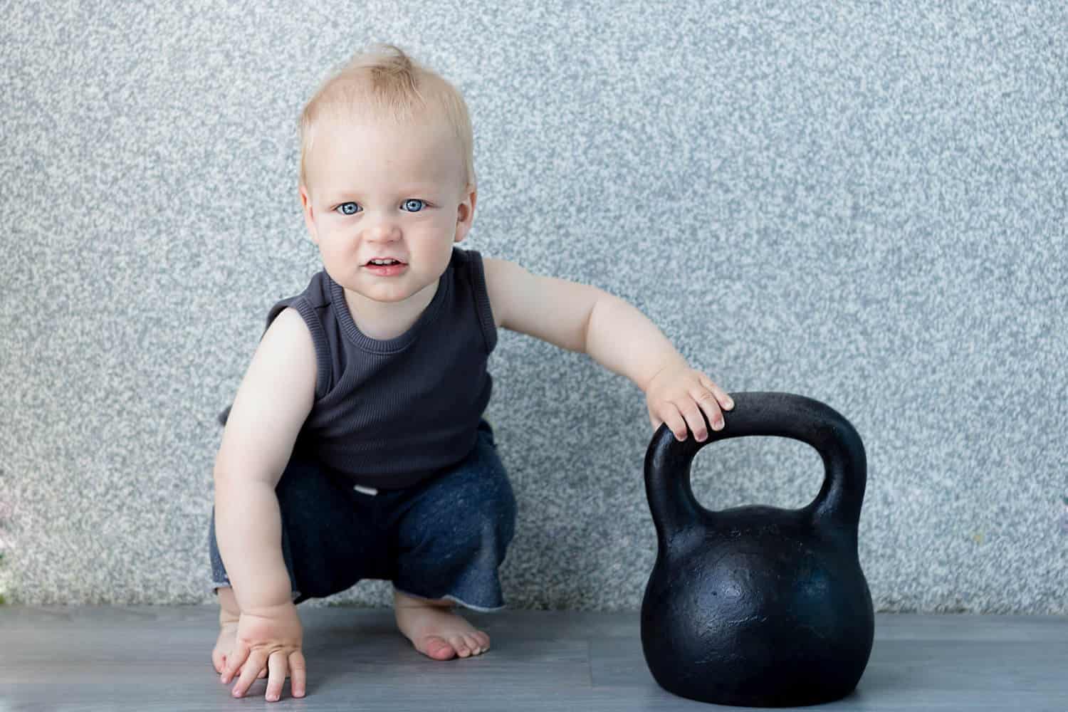 strong badass baby boy with weight