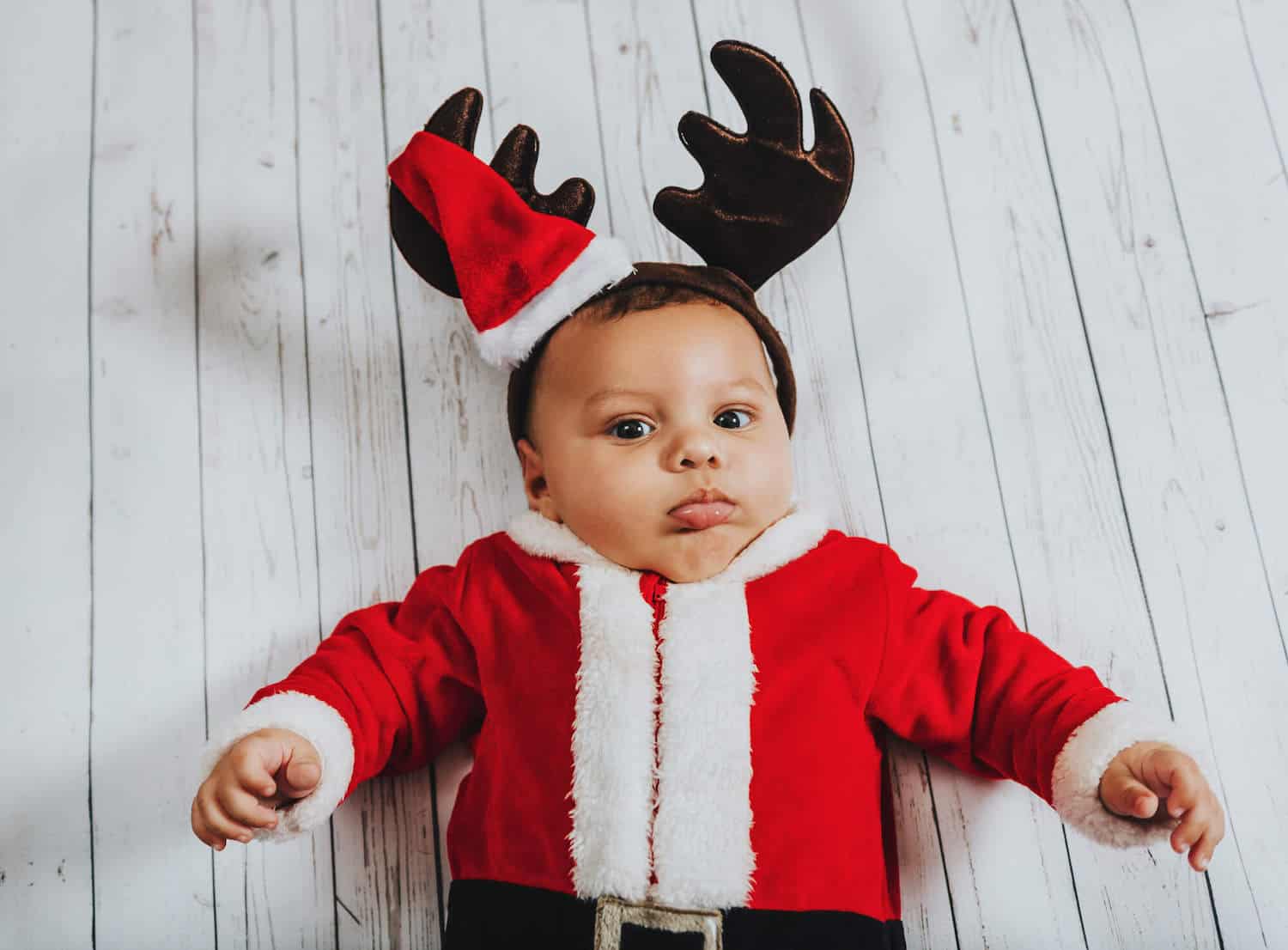 baby boy in christmas santa outfit