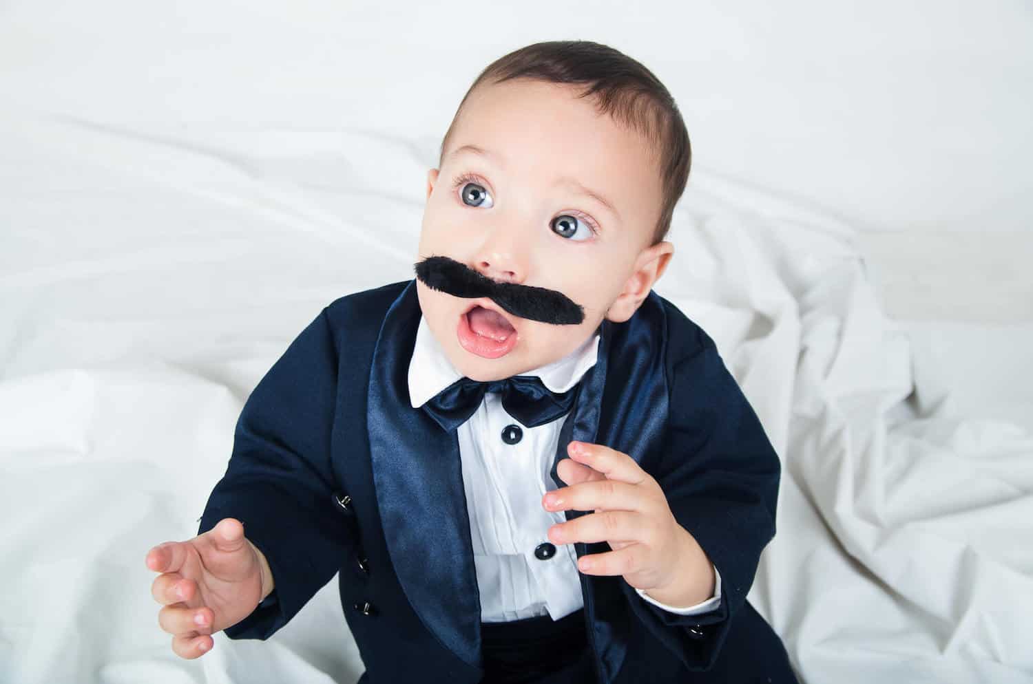 elegant baby boy pretend mustache tuxedo