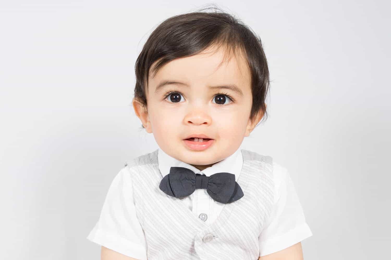 sophisticated baby boy with vest and bow tie